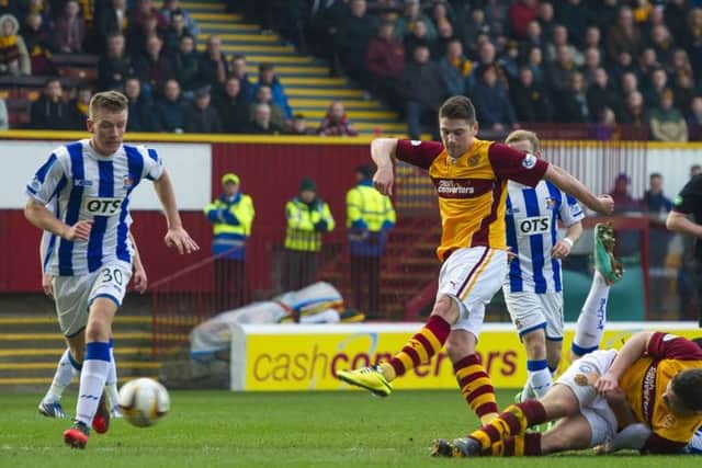 Iain Vigurs (centre) puts Motherwell ahead against Kilmarnock. Picture: SNS