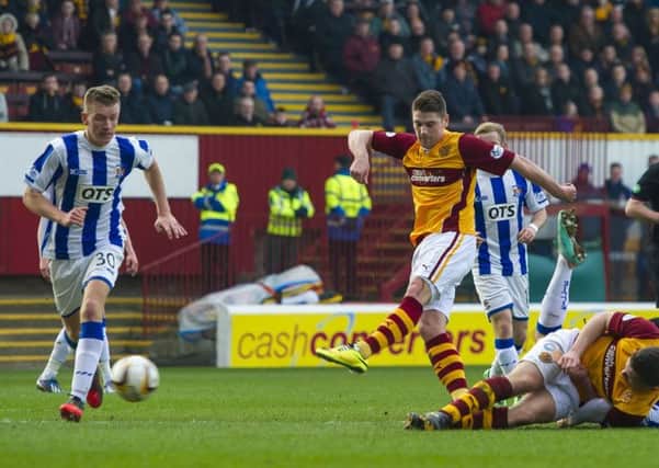 Iain Vigurs (centre) puts Motherwell ahead against Kilmarnock. Picture: SNS