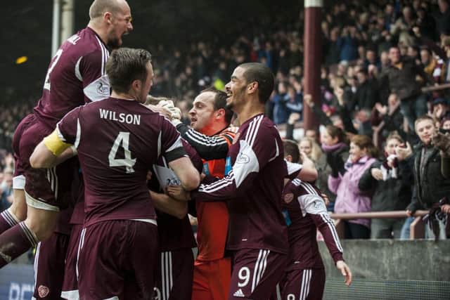 Hearts have the last laugh as they celebrate Billy Kings late goal.  Pictures: SNS