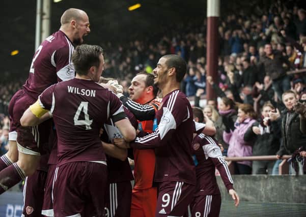 Hearts have the last laugh as they celebrate Billy Kings late goal.  Pictures: SNS