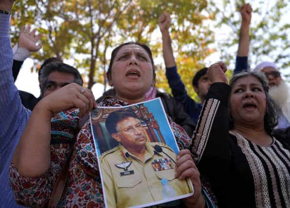 Supporters of Pervez Musharraf outside the court in Islamabad. Picture: Getty