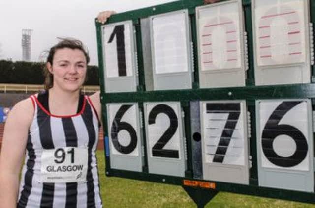 Rachel Hunter alongside confirmation of the distance which took her past the qualifying standard. Picture: Bobby Gavin