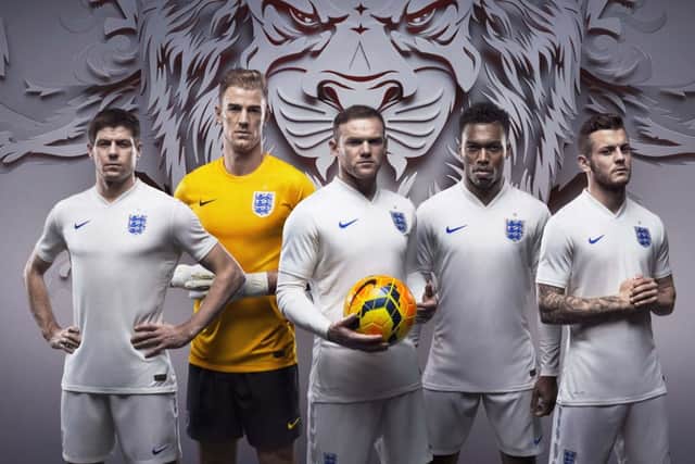 England players, including Steven Gerrard and Wayne Rooney, model the new strips. Picture: PA