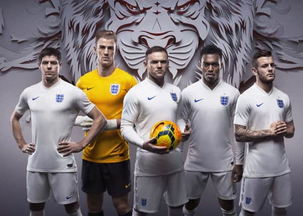 England players, including Steven Gerrard and Wayne Rooney, model the new strips. Picture: PA