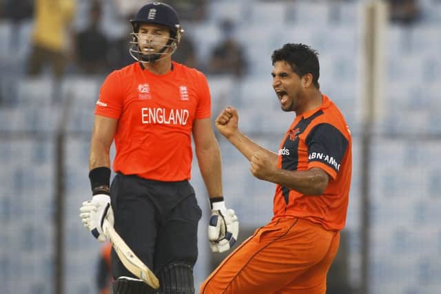 Hollands Mudassar Bukhari celebrates the wicket of Englands Michael Lumb during yesterdays victory. Picture: AP