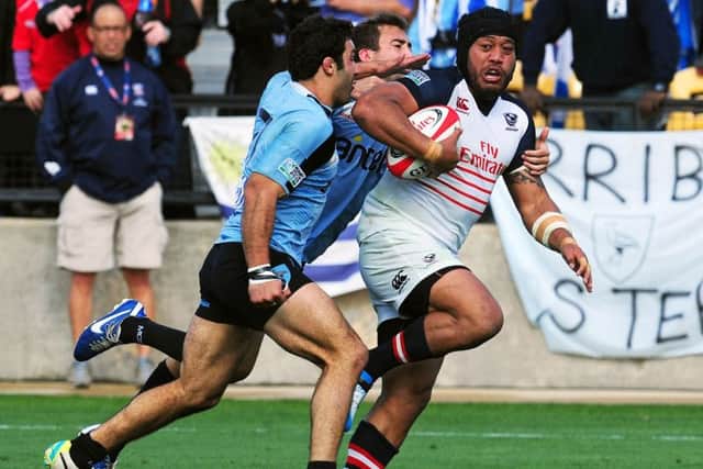 Andrew Suniula of the USA on his way to scoring a try against Uruguay in a qualifying match for the 2015 IRB Rugby World Cup. Picture: Getty