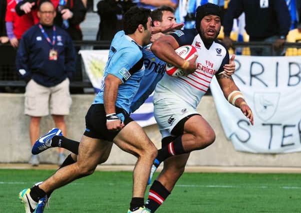 Andrew Suniula of the USA on his way to scoring a try against Uruguay in a qualifying match for the 2015 IRB Rugby World Cup. Picture: Getty