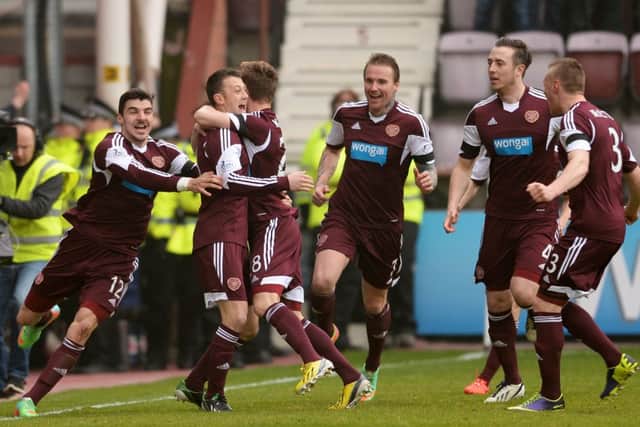 Dale Carrick (2nd from left) celebrates after opening the scoring against Hibs at the weekend. Picture: SNS