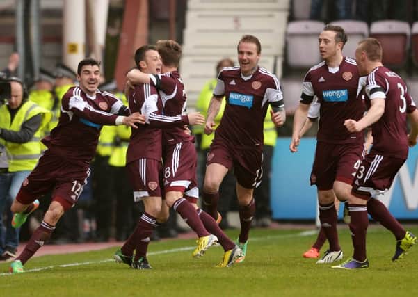 Dale Carrick (2nd from left) celebrates after opening the scoring against Hibs at the weekend. Picture: SNS