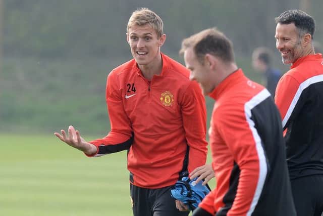 Darren Fletcher gets smiles out of Wayne Rooney and Ryan Giggs as United prepare to take on Bayern Munich. Picture: PA