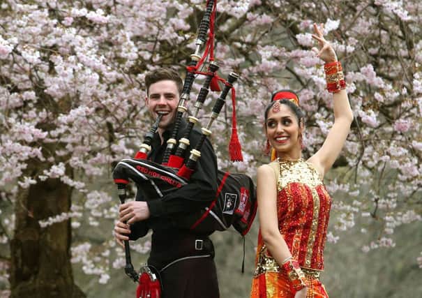 Dougie McCance from the Red Hot Chilli Pipers with Bollywood dancer Pooja Berman, at the launch of Glasgow Mela. Picture: PA