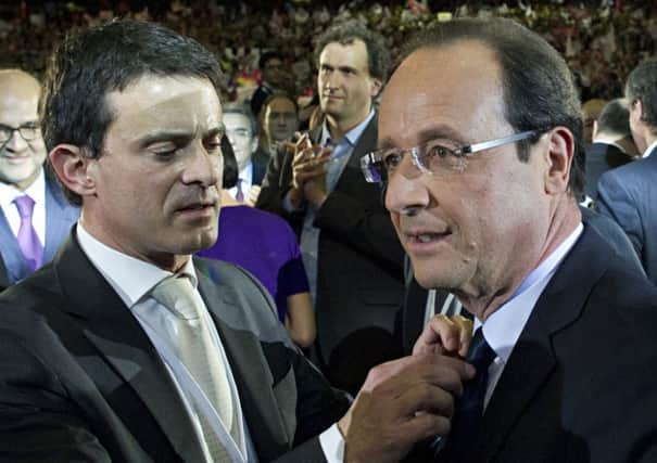 Francois Hollande talks with his 2012 campaign communications director Manuel Valls. Picture: AFP