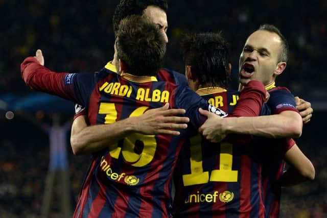 Neymar is mobbed by his Barcelona team-mates after his equalising goal against Atletico Madrid. Picture: Getty
