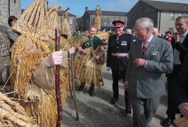 The Prince of Wales  meets a group of Irish Mummers at Enniskillen Castle museum. Picture: PA
