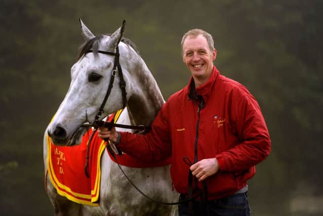Trainer David Pipe at his Pond House stables with Dynaste. Picture: Andrew Matthews/PA