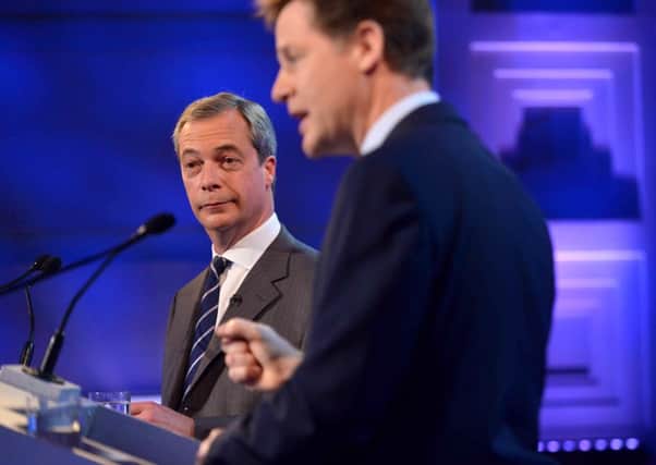 Nigel Farage looks on as Nick Clegg speaks. Picture: Getty