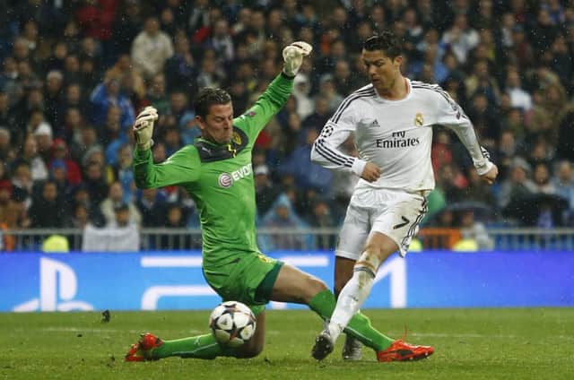 Cristiano Ronaldo slots home Real Madrids third goal. Picture: AP