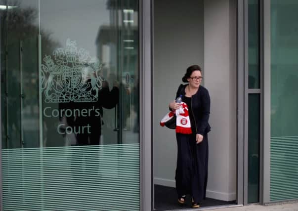 A woman with a Liverpool FC scarf leaves the court in Warrington.. Picture: Getty