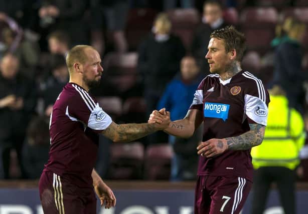 Ryan Stevenson, right, with scorer Jamie Hamill after the final whistle as Hearts avoided relegation. Picture: SNS
