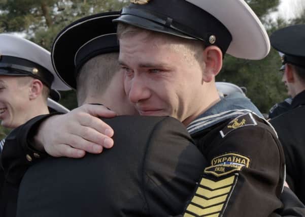 Naval cadets bid farewell, as 120 who refused to take Russian citizenship leave the college in Sevastopol. Picture: Getty Images