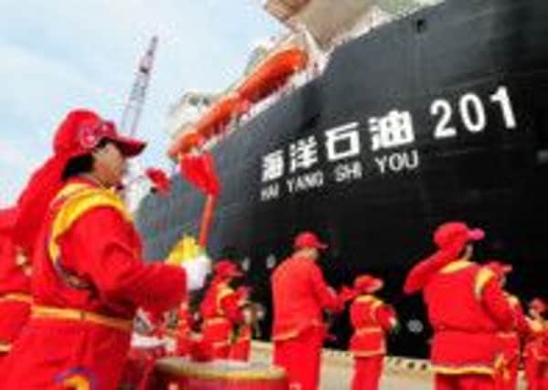 Drummers perform at a ceremony to send off China National Offshore Oil Corp in 2012. Picture: Getty