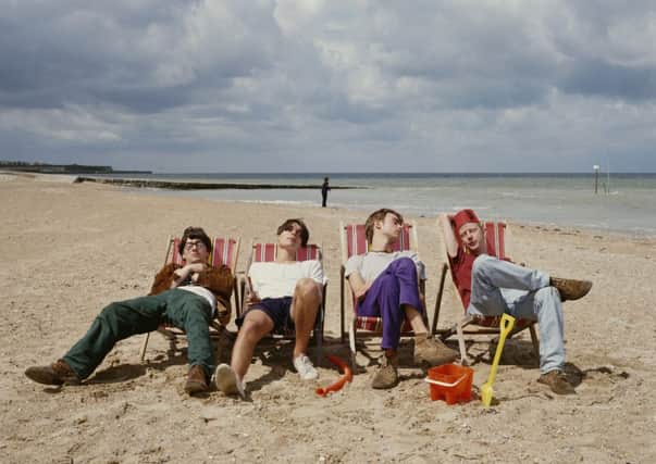 Blur relax on a beach, circa 1995. From left to right, Graham Coxon, Alex James, Damon Albarn and Dave Rowntree. Picture: Getty
