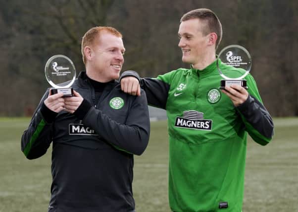 Neil Lennon, left, and Liam Henderson show off their SPFL awards at Lennoxtown yesterday. Picture: SNS