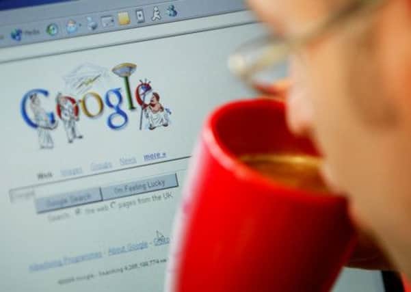 An internet surfer views the Google home page at a cafe in London. Picture: Reuters