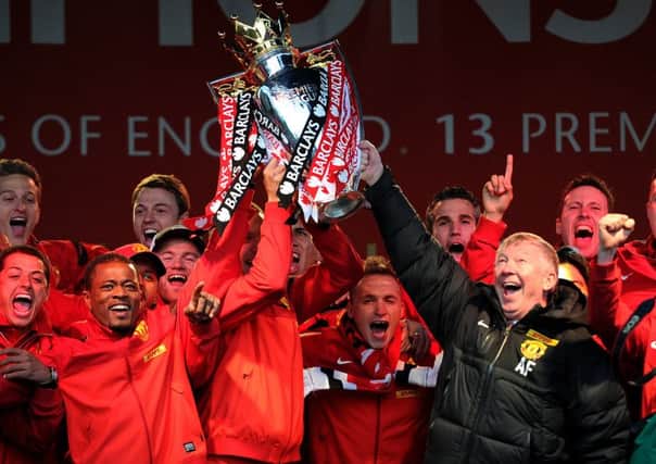 Sir Alex Ferguson lifts the Barclays Premier League trophy with his squad last May. Few Manchester United supporters would have thought at the time that it may be the Old Trafford clubs last championship triumph for a while. Picture: Getty