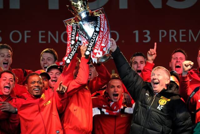Sir Alex Ferguson lifts the Barclays Premier League trophy with his squad last May. Few Manchester United supporters would have thought at the time that it may be the Old Trafford clubs last championship triumph for a while. Picture: Getty