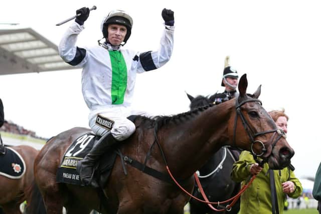 Leighton Aspell celebrates on Pineau de Re after winning the Grand National. Picture: PA