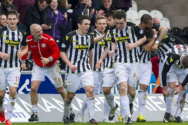 St Mirren players mob Stephen Thompson after his second, and St Mirren's third gave them an unlikely win. Picture: SNS