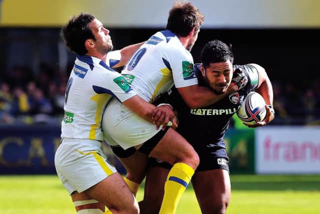Clermont half-backs Brock James and Morgan Parra double up to halt the progress of Leicesters Manu Tuilagi. Photograph: Getty Images