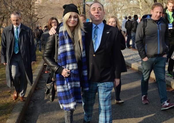 Alex Salmond walks with  singer Nina Nesbitt near the finish line of the Scotland Run, a 10K road race through New York's Central Park. Picture: Getty