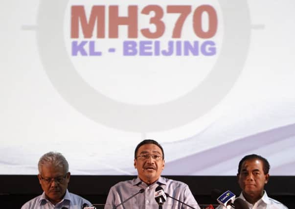 Malaysian acting Transport Minister Hishammuddin Hussein, center. Picture: AP