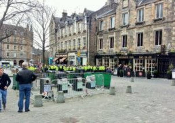 A huge number of police surround Rangers fans in the Grassmarket after trouble flared ahead of the Ramsdens Cup Final at Easter Road. Pic: submitted