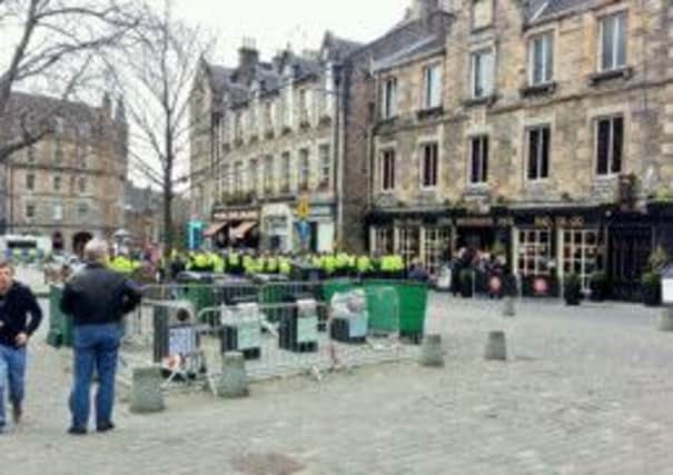 A huge number of police  surround Rangers fans in the Grassmarket after trouble flared ahead of the Ramsdens Cup Final at Easter Road. Pic: submitted
