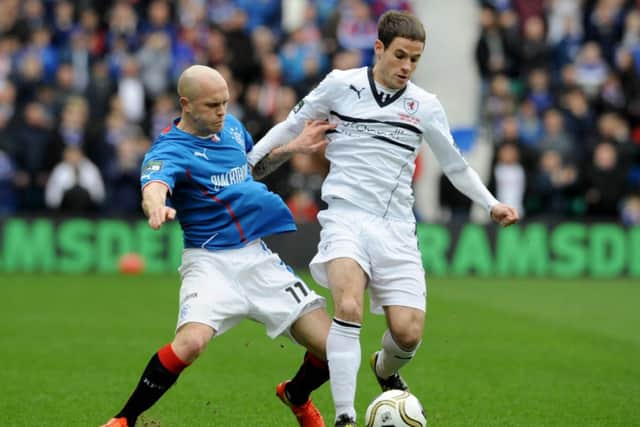 Rangers' Nicky Law and Rovers' Kevin Moon battle for the ball. Picture: Jane Barlow
