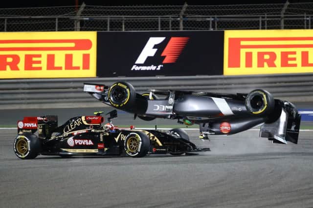 Esteban Gutierrezs Sauber flips over after a collision with Pastor Maldonado. Picture: AFP