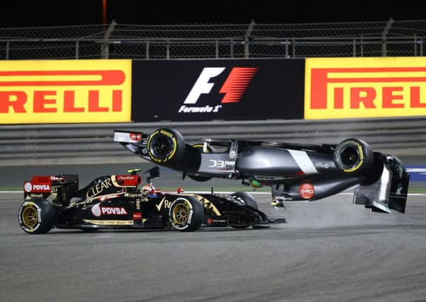 Esteban Gutierrezs Sauber flips over after a collision with Pastor Maldonado. Picture: AFP