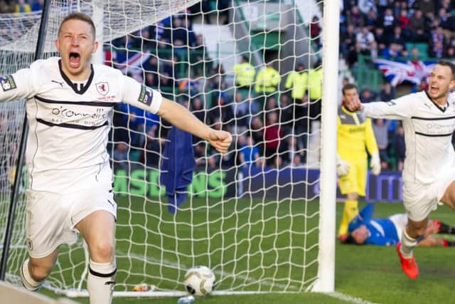 An ecstatic Raith Rovers striker John Baird races off to celebrate his cup-winning goal. Pictures: SNS