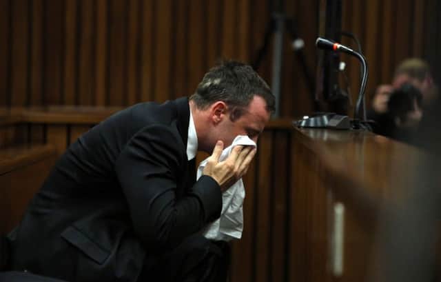 Oscar Pistorius wept as he listened to evidence given by a pathologist in the courtroom in Pretoria. Picture: AP