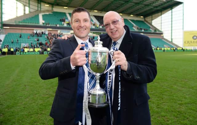 Rovers chairman Turnbull Hutton shows off the Ramsdens Cup with manager Grant Murray. Picture: SNS