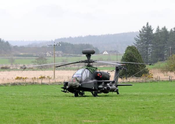 An army Apache helicopter  in a field near Maryculter, Aberdeenshire that was forced to make an emergency landing. Picture: Hemedia
