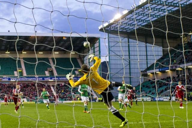 Hibs keeper Ben Williams is helpless as Niall McGinn scores after 14 minutes. Picture: SNS