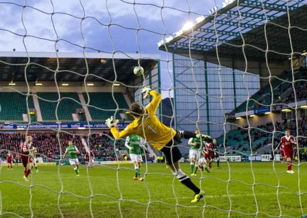 Hibs keeper Ben Williams is helpless as Niall McGinn scores after 14 minutes. Picture: SNS