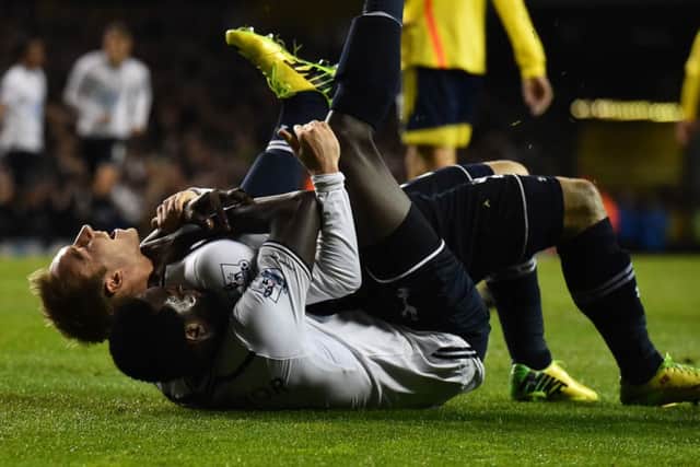 Christian Eriksen (top) celebrates with two-goal Emmanuel Adebayor after scoring Tottenhams third goal. Picture: Getty