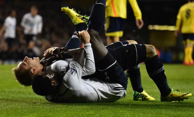 Christian Eriksen (top) celebrates with two-goal Emmanuel Adebayor after scoring Tottenhams third goal. Picture: Getty
