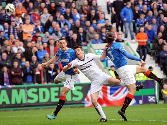 Lee Wallace and Bilel Mohsni compete with Dougie Hill in the final of the Ramsdens Cup. Picture: Neil Doig