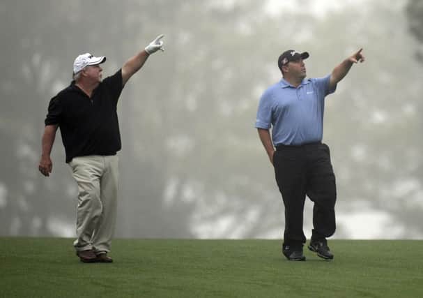 Craig Stadler and his son Kevin make their point as they walk up a fairway during a practice round. Picture: Getty